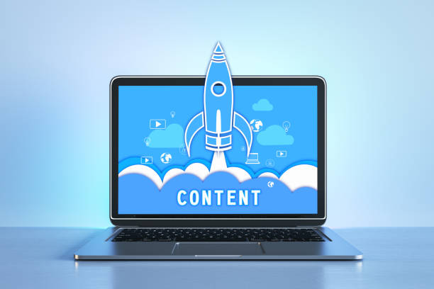 istock Blue-themed laptop screen showing content marketing rocket launch. Online engagement. 3D Rendering 1809165016