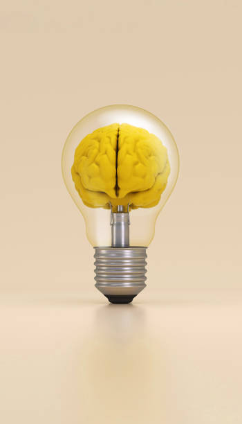 Light bulb with a brain inside illuminated on yellow background. Innovation concept.