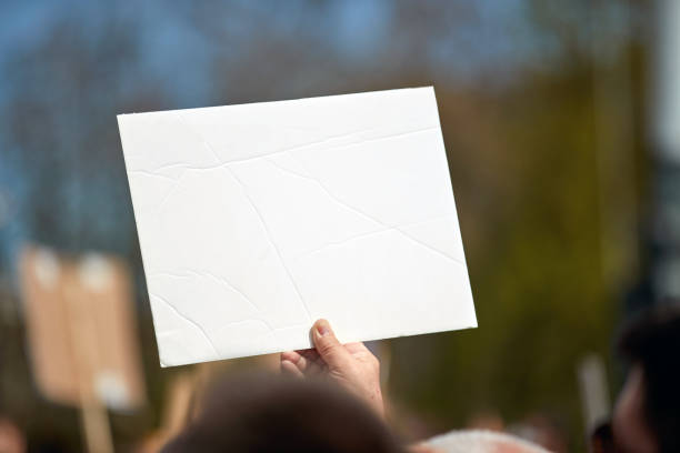 istock Protesters holding placards and signs on the streets. 1809193541
