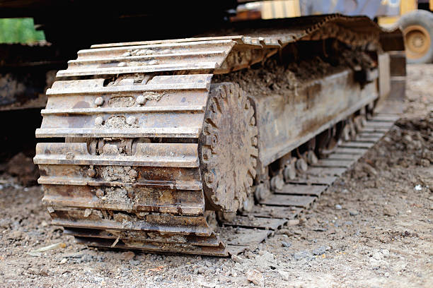 istock Construction excavator track loaders disrepair 180921454