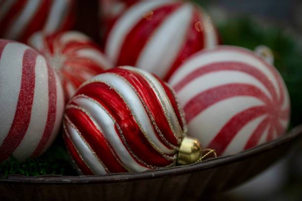 istock Bowl with red and white ornaments sitting atop a table 1809228121