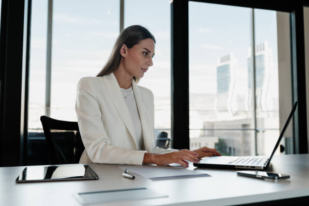 istock Businesswoman working using her laptop computer in the office 1809241421