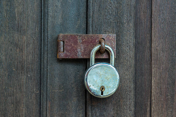 istock Old padlock on a wooden door 180924145