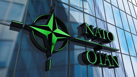 NATO OTAN Sign on Building's Window. 3D Render