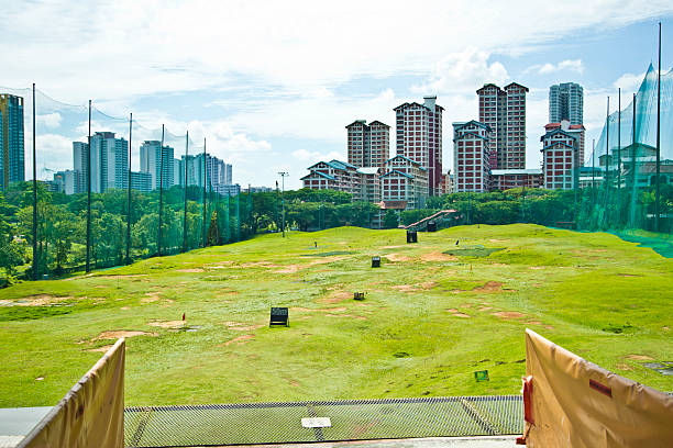 Multi Story Golf Practice Range in Urban Singapore stock photo