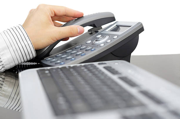 istock businessman is picking up the phone in office 180926697