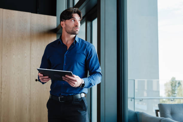 istock Young businessman using his smartphone outdoors on the office terrace 1809282929