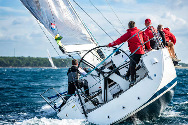Sailing crew on sailboat on regatta