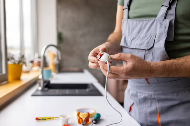istock Electrician repairing a light bulb socket in an apartment 1809286684