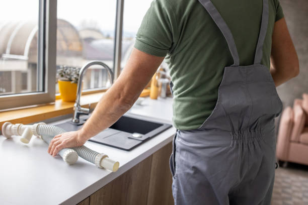 istock Plumber repairing a broken sink in a clients apartment 1809286688
