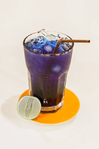 istock Delicious butterfly pea beverage with the sliced lemon on table 180929080