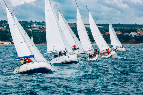 Sailing crews on sailboats on regatta