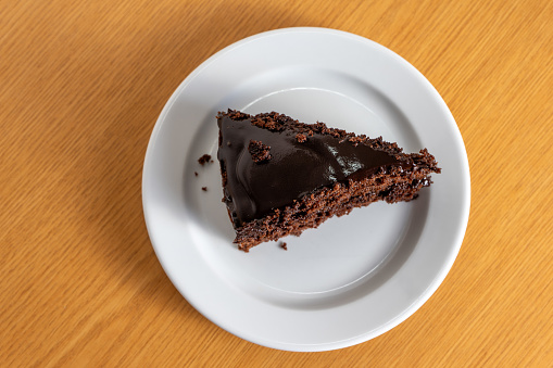 Indulge in a decadent slice of rich chocolate cake, a heavenly treat that promises pure delight for your taste buds. Perfectly moist and irresistible.