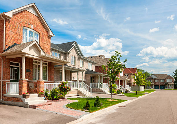 Suburban homes Suburban residential street with red brick houses boulevard photos stock pictures, royalty-free photos & images