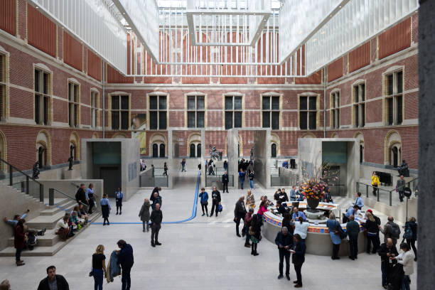 Amsterdam, Netherlands - April 21, 2023: Rijksmuseum, people in the original interior courtyard have been redesigned to create the imposing new entrance space of the Atrium.