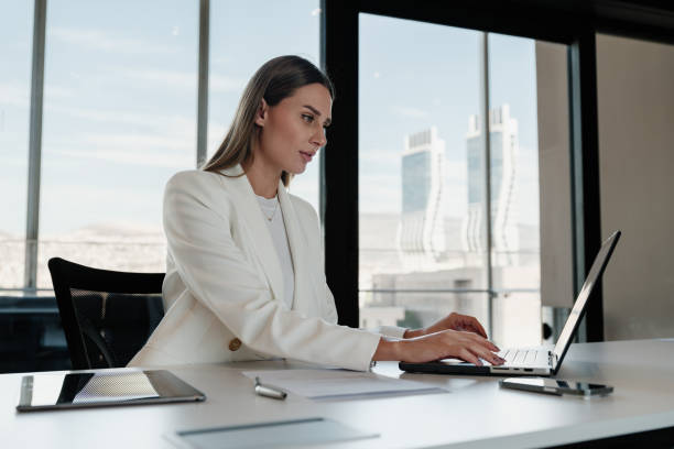 istock Businesswoman working using her laptop computer in the office 1809328365