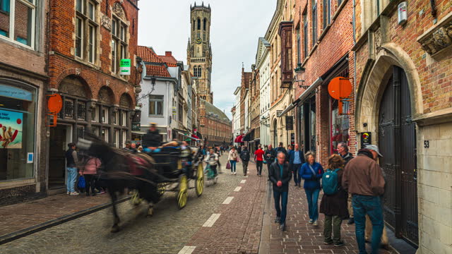 Time lapse of Crowd of People tourism walking and sightseeing attraction at Belfort of Bruges and Grote Market square in Bruges, Belgium