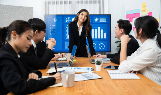 istock Businesswoman give presentation on dashboard data on screen at harmony office. 1809336355