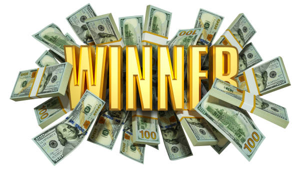 istock US dollar notes spread behind 3D golden Winner text. 3d text in front of of bank notes.3d rendering 1809346622