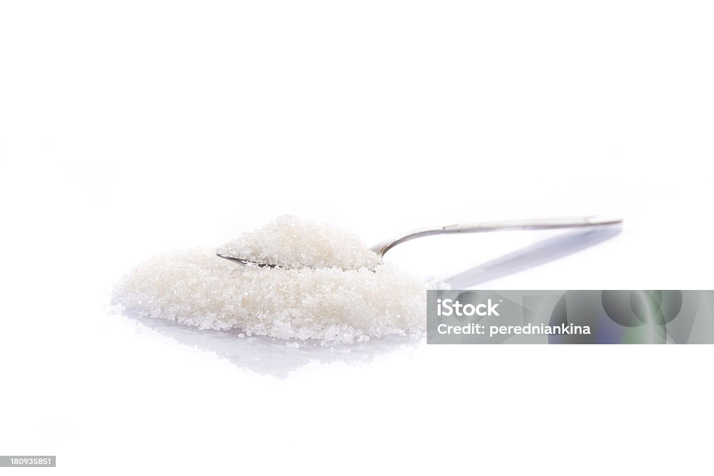 granulated sugar in a spoon granulated sugar in a spoon on a white background Beet Stock Photo