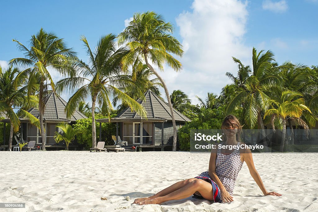 Girl on the white sandy beach (Maldives - Lhaviyani Atoll) The girl on the white sandy beach (Maldives - Lhaviyani Atoll) Adult Stock Photo