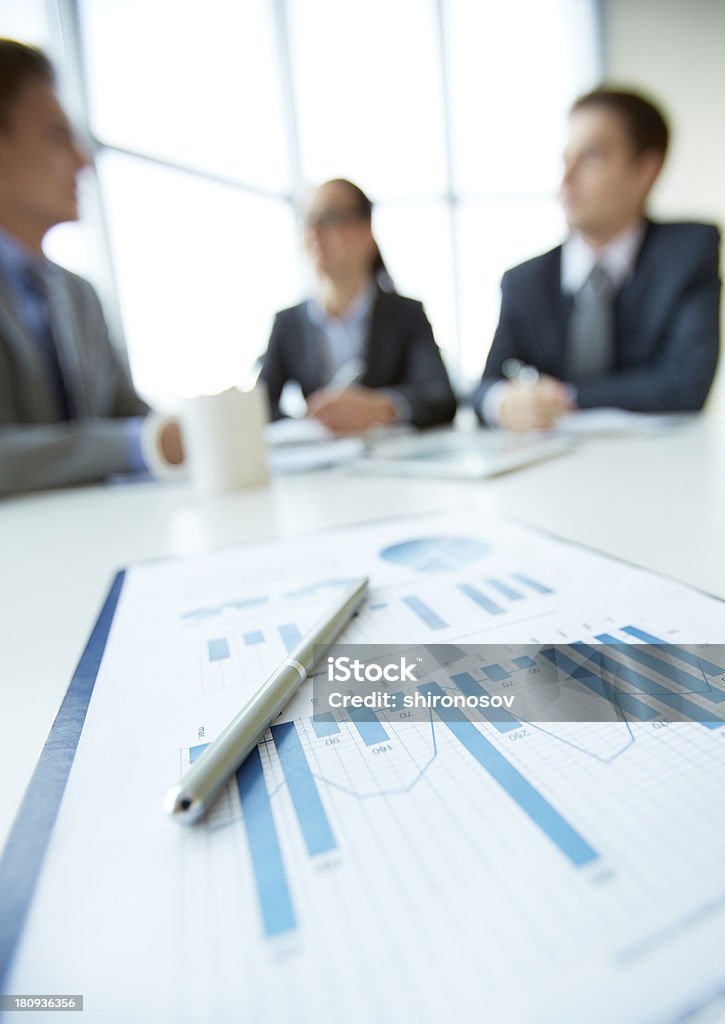 Business analysis Business document on background of employees planning work at meeting Business Meeting Stock Photo