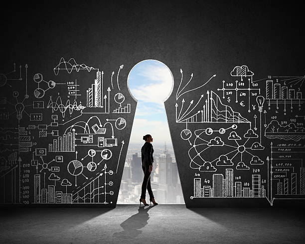 istock Woman in front of a wall with illustrated plans 180936732