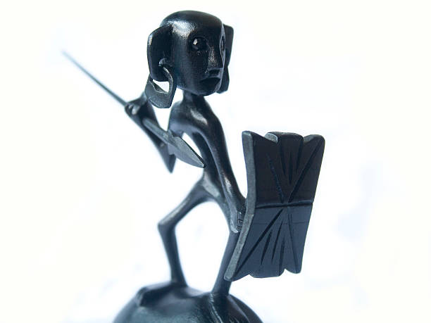 istock Wooden Tribal sculpture with spear and shield 180937123