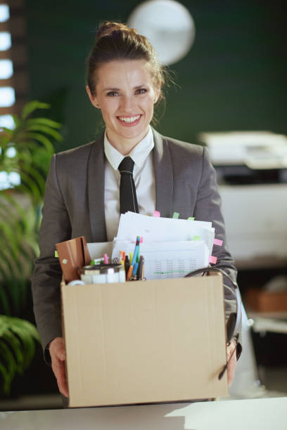 istock smiling modern woman employee in modern green office 1809385580