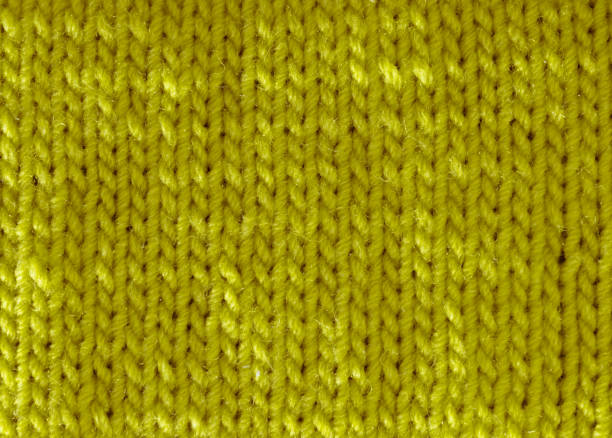 istock The texture of the satin stitch pattern is knitted with olive wool yarn. 1809385813