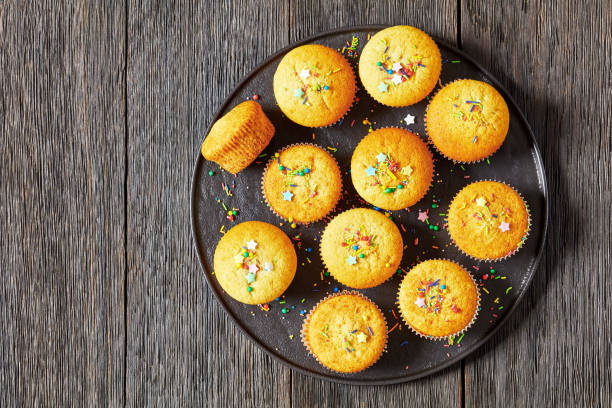 istock sweet lemon muffins on black plate, top view 1809386116