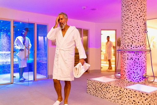 Modern men relaxing and enjoying in the spa