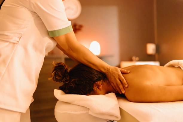 istock Relaxed woman having a massage in the beautiful spa 1809393768