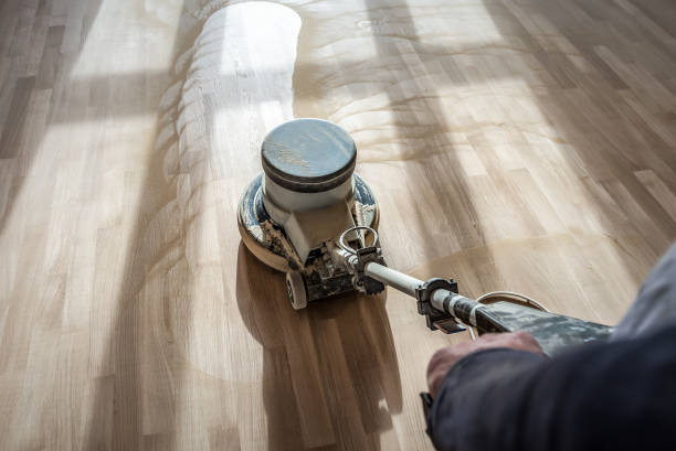 Polishing wooden parquet floor with special orbital machine Polishing wooden parquet floor with special professional orbital machine sand paper stock pictures, royalty-free photos & images