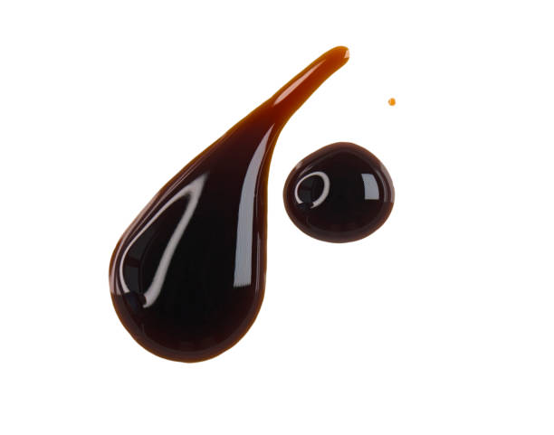 istock Drops of liquid brown sauce unagi, soy isolated on white, clipping path 1809412380