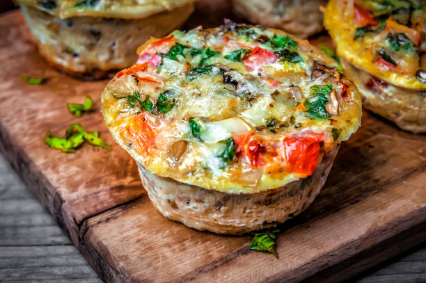 istock Delicious egg muffins with ham, cheese and vegetables 1809413458