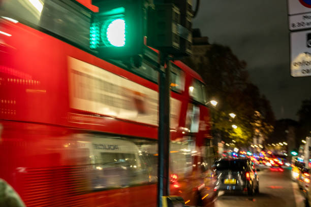 London metropolitan area red bus speed passing by