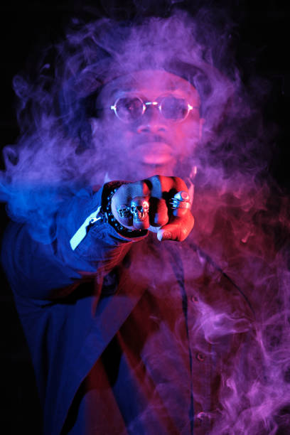 istock Serious ethnic man punching through vapor 1809425159