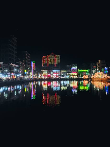 istock Modern Downtown City Skyline with Illuminated Buildings Reflecting on Water 1809426296