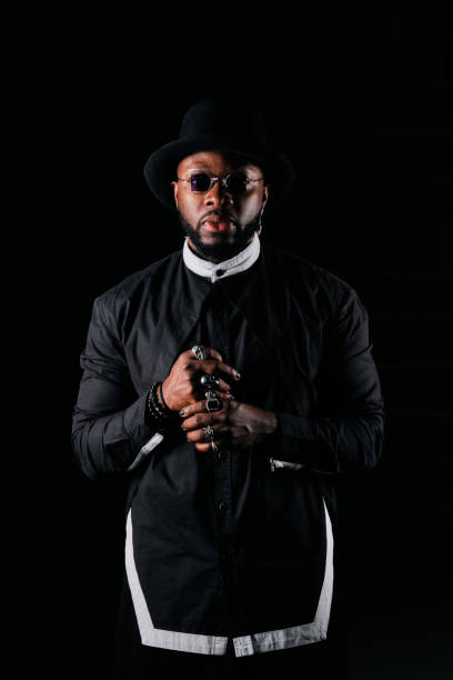 istock Serious stylish African American on black background 1809426303