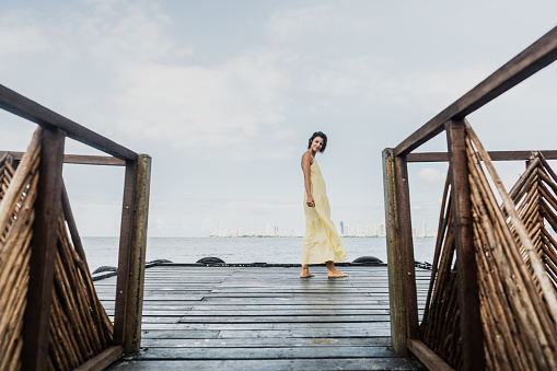Portrait of a young woman on the beach pier