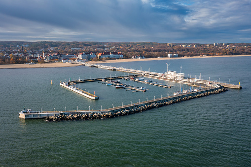 Aerial view of the Baltic sea coastline and wooden pier in Sopot at autumn, Poland