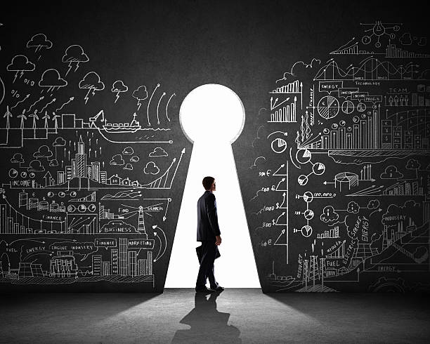 istock Businessman walking through a keyhole between business plans 180943619
