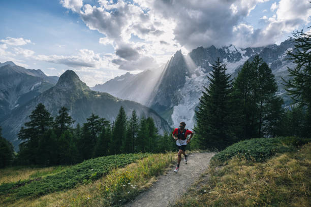 istock Trail runner bounds along mountain trail 1809454166