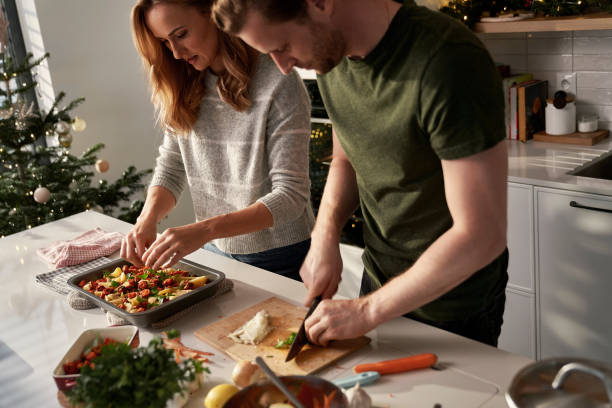 Caucasian couple cooking together  before Christmas