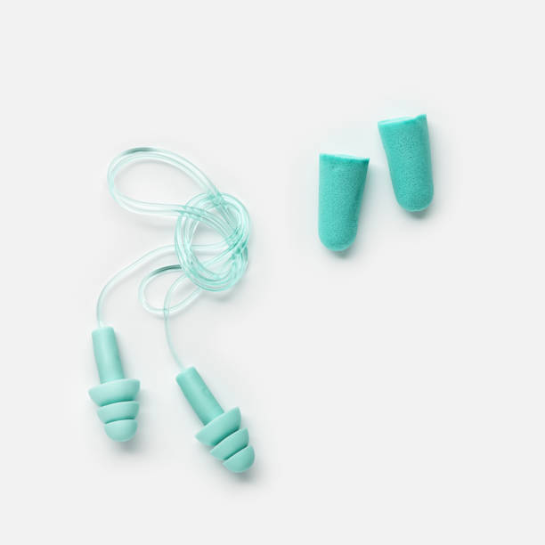 istock Set Colored earplugs on white background, reusable silicone and rubber ear plug on cord against noise, protect hear, for swim, sleep, rest. Creative aesthetic flat lay, above view, pastel tones 1809459393