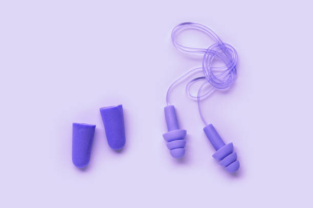 istock Different ear plugs as minimal monochrome composition, comfort silicone and rubber ear plug on string protection against noise, protect hear, for swim, sleep, rest. Top view flat lay photo 1809459992