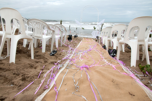 Photos of a wedding set on a beach.