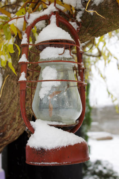 istock A decorative red glass old lantern decorates a tree with yellow leaves 1809477365