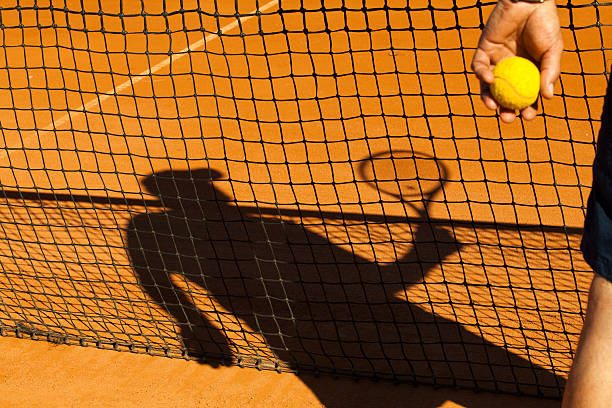istock Shadow on the tennis court 180947805
